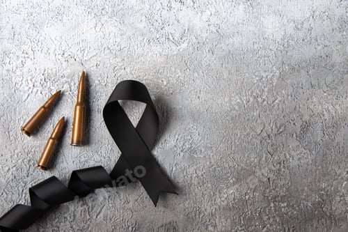 Preview: top view of black bow with bullets on white surface tank war death soldier