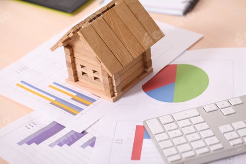Preview: holding house representing home ownership and the Real Estate business