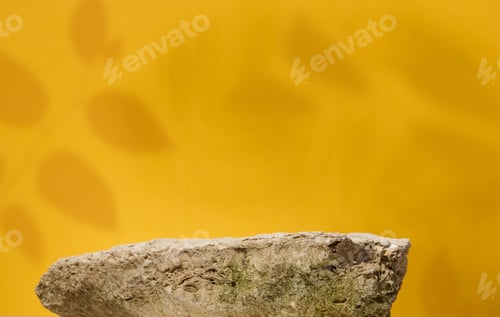 Preview: Stones on yellow background, stage for advertising and product demonstration