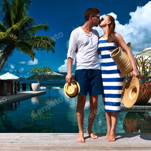Preview: Couple Kissing Near Poolside Jetty At Seychelles
