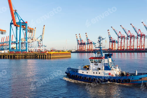 Preview: Scenic view powerful tow ship service team sealing at Hamburg Elbe harbour at evening sunset day
