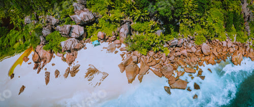 Preview: Aerial top panoramic view of granite rocks and tropical beach on the Petite Anse beach, La Digue