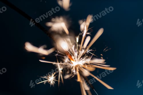 Preview: Bengal fire sparkles against the black background.