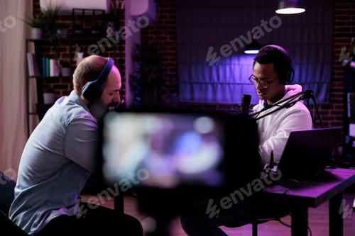 Preview: Show presenter recording video conversation with man on podcast