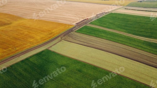 Preview: High up aerial view of beautiful agricultural field at daytime