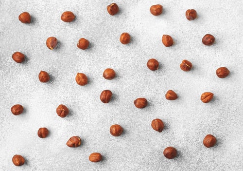 Preview: Pattern of hazelnuts on grey surface top view