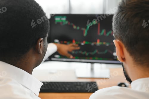 Preview: Two successful trader sitting in office, checking cryptocurrency information data