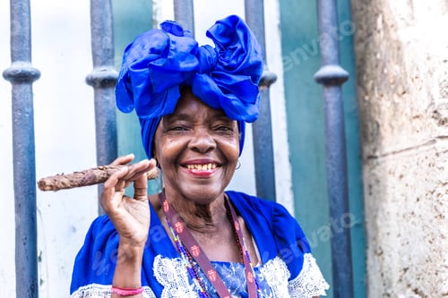 Preview: Portrait Of African Cuban Woman Smoking Cigar In Havana, Cuba