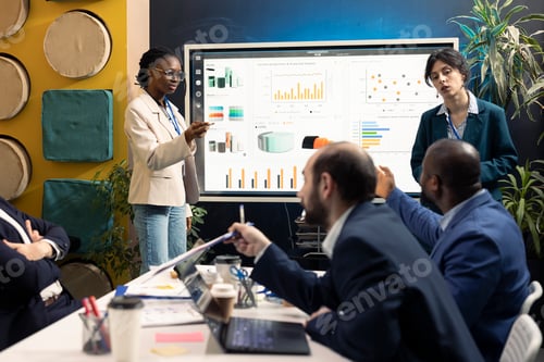 Preview: Staff members from a business organization discussing details and updates