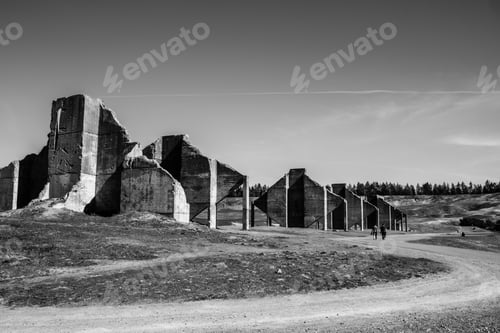 Preview: a black and white photo of an old castle ruins and road