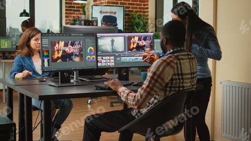 Preview: Team of artistic content creators editing movie montage on software