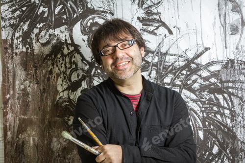 Preview: Painter artist posing in front of paint