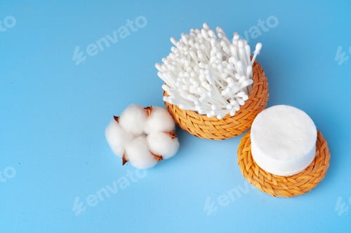 Preview: Set of cotton buds sticks on blue paper