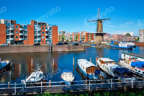 Preview: View of the harbour of Delfshaven and the old grain mill De Destilleerketel. Rotterdam, Netherlands