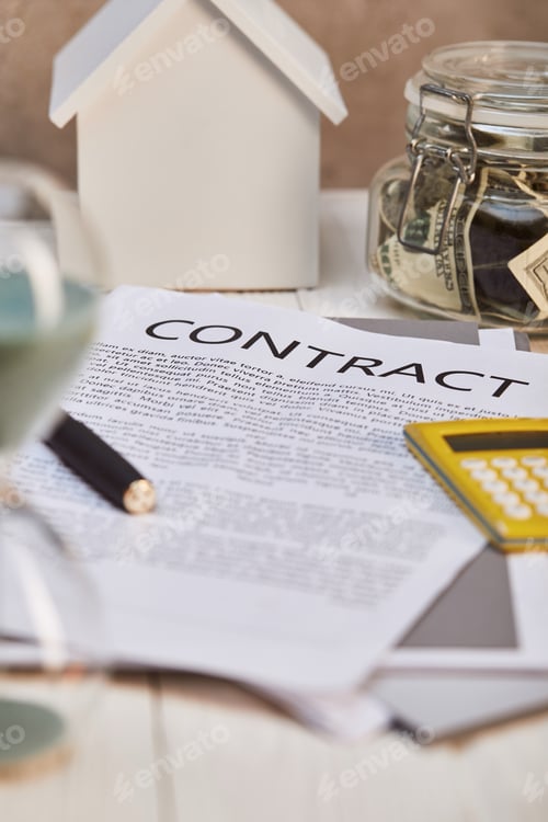Preview: selective focus of house model , contract and moneybox, real estate concept