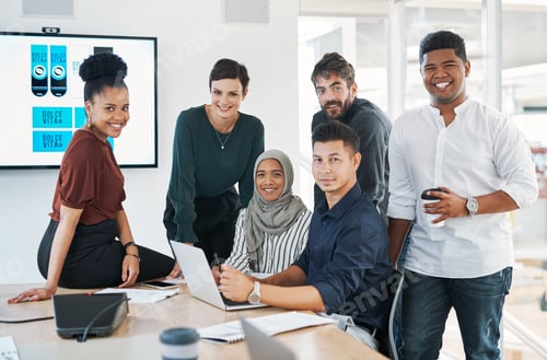 Preview: Shot of a group of businesspeople using a laptop during a meeting in a modern office