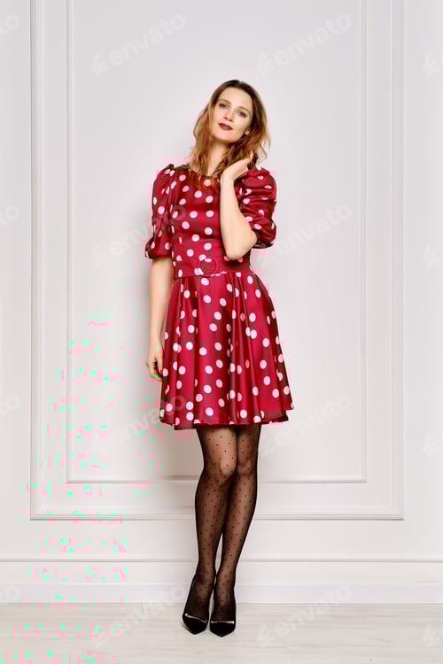 Preview: Portrait of young woman in dotted satin dress and polka dot tights