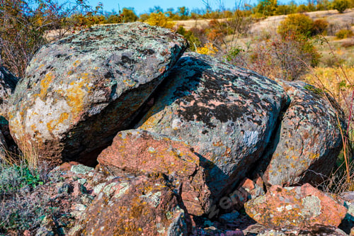 Preview: Huge deposits of stone minerals in a clearing bathed in warm sun in picturesque Ukraine