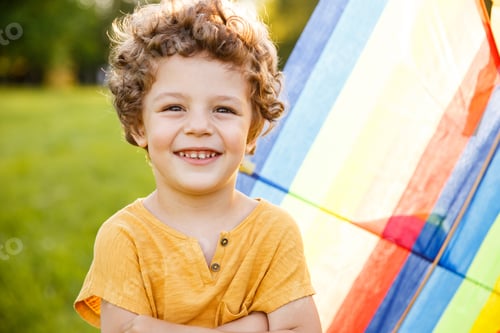 Preview: Blonde boy with arms crossed posing outside