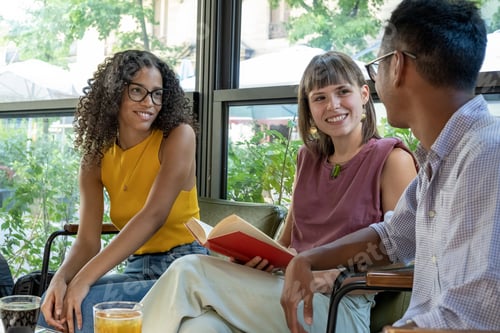 Preview: Happy young university students having a moment of relax in a cafeteria