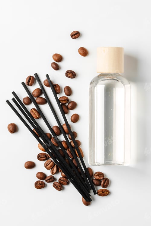 Preview: Scented oil diffuser with coffee beans and reeds arranged on a white background