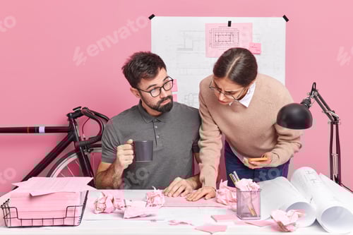 Preview: Two graphic designers collaborate on building sketches share different ideas for creating new room b