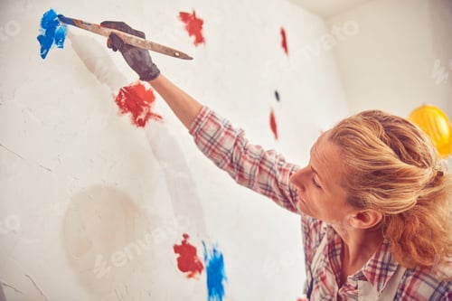 Preview: Working Woman Plastering / Painting Walls Inside The House.