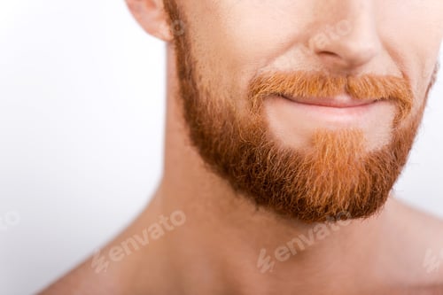 Preview: Beard is his style. Close-up of bearded man smiling while standing against white background