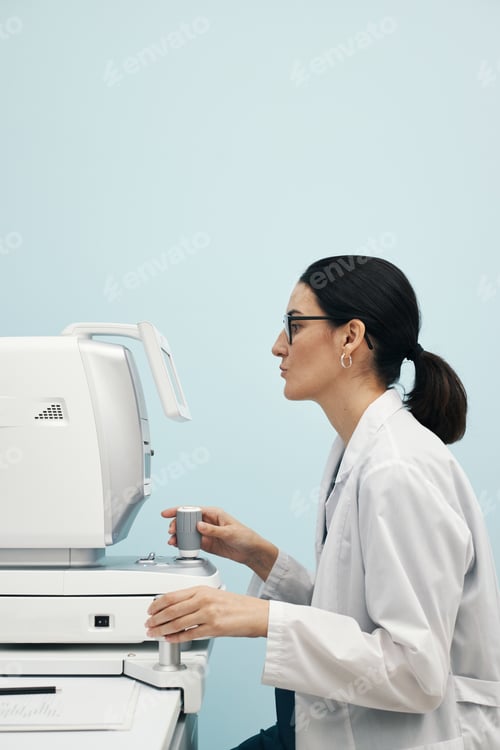Preview: Young Female Doctor Operating Ophthalmology Diagnostic Equipment