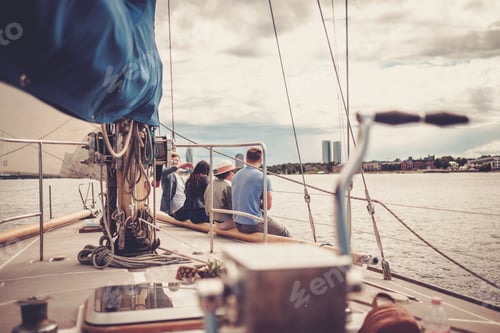 Preview: Happy friends resting on a yacht