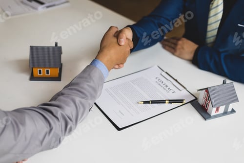 Preview: Businessman handshake after reaching a real estate deal.