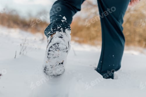 Preview: Close up of a lone traveler legs, gracefully navigating the winter wonderland