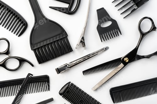 Preview: Black hairdressing tools and various hairbrushes on white background