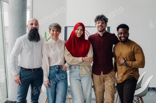 Preview: Startup business team standing united in modern office