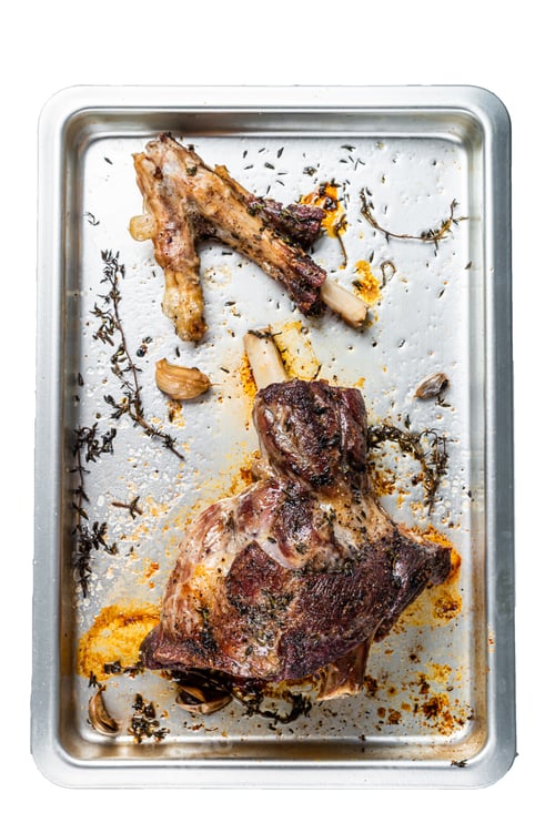 Preview: Roasted lamb mutton whole leg in a baking dish. High quality Isolate, white background.