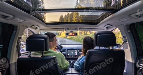 Preview: Man and woman traveling in car, sitting in car driving to travel destination.