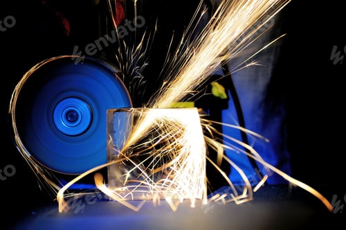 Preview: Worker cutting metal with grinder
