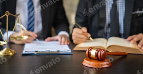 Preview: Lawyer or judge reading the law in client's trial at the lawyer's office, litigation consultation id