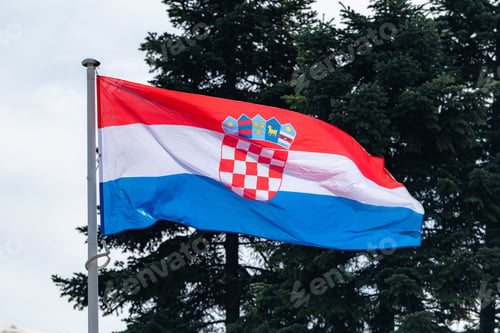 Preview: The national flag of Serbia waving in the blue sky