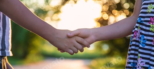 Preview: Children walk hand in hand. Selective focus.