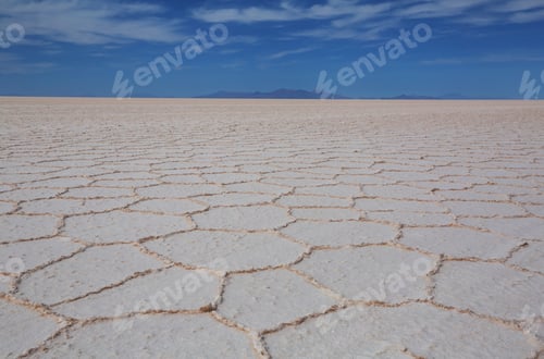Vast Salt Flats Under a Bright Blue Sky