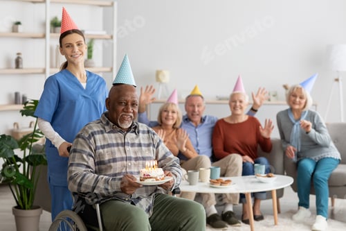 Preview: Disabled senior black man having birthday party at nursing home