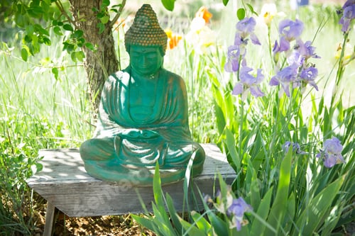 Preview: A turquoise Buddha figure in a tranquil garden
