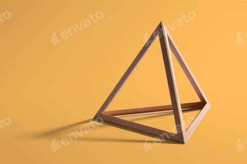 Preview: Wooden triangular frame on yellow background