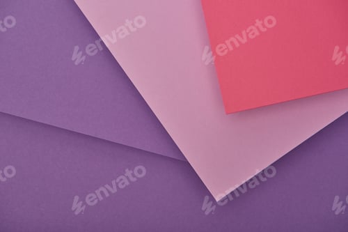 Preview: top view of lilac, violet and pink paper sheets with copy space