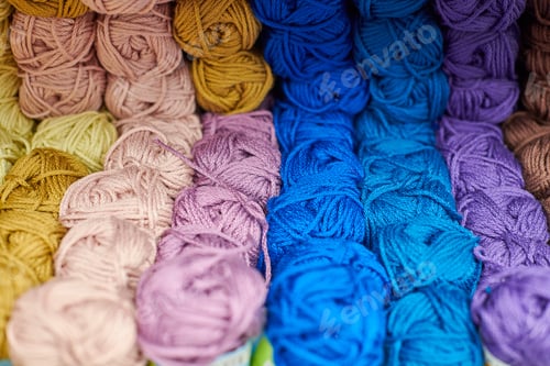 Preview: Yarns or balls of wool on shelves in store for knitting