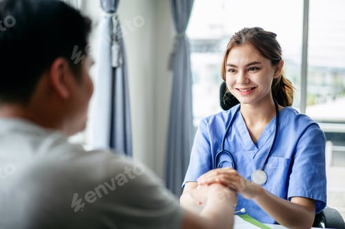 Preview: Supportive Doctor with Patient in Hospital Room