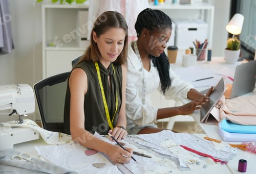 Preview: Young fashion designer working in her atelier, Small business concept.