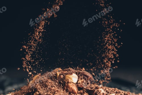 Preview: Falling shredded chocolate pieces on a chocolate pile