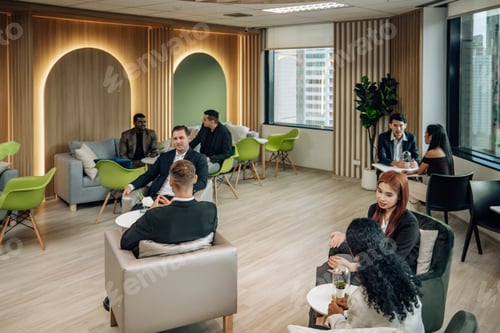 Preview: Diverse businesspeople collaborate at cozy conference, exchanging ideas and partnerships for growth